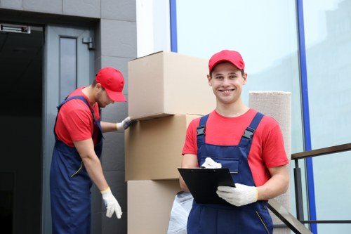 Workers sorting recyclable cardboard and packaging at Beckenham Storage