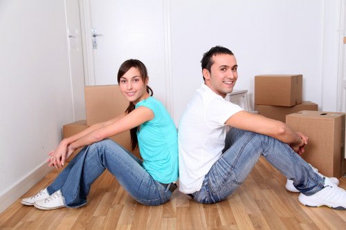 Organized storage space with boxes and furniture in Beckenham